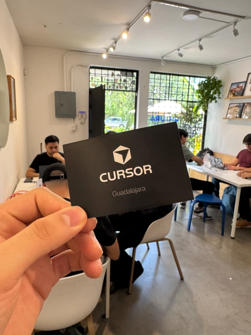 Juan holding a Cursor Guadalajara card