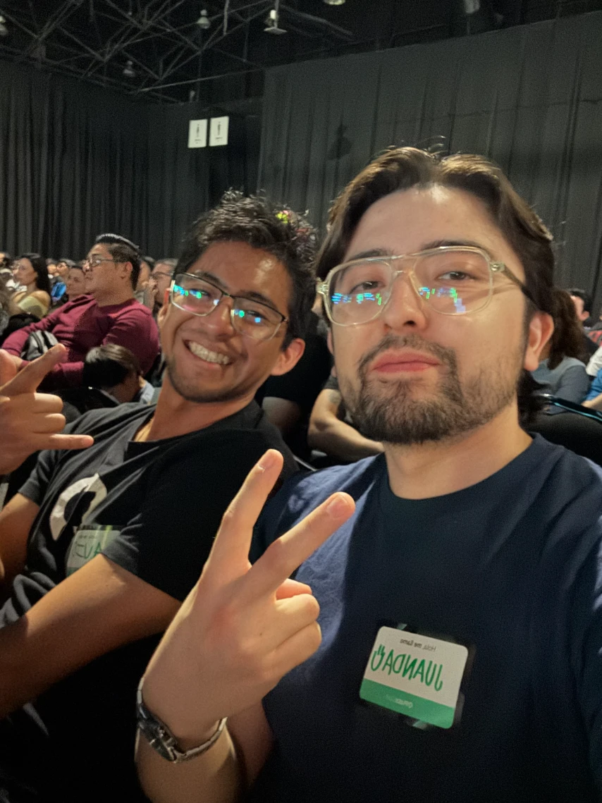 Juan with a friend in Platzi Conf 2026